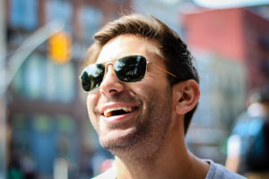Smiling man in sunglasses: CMC
